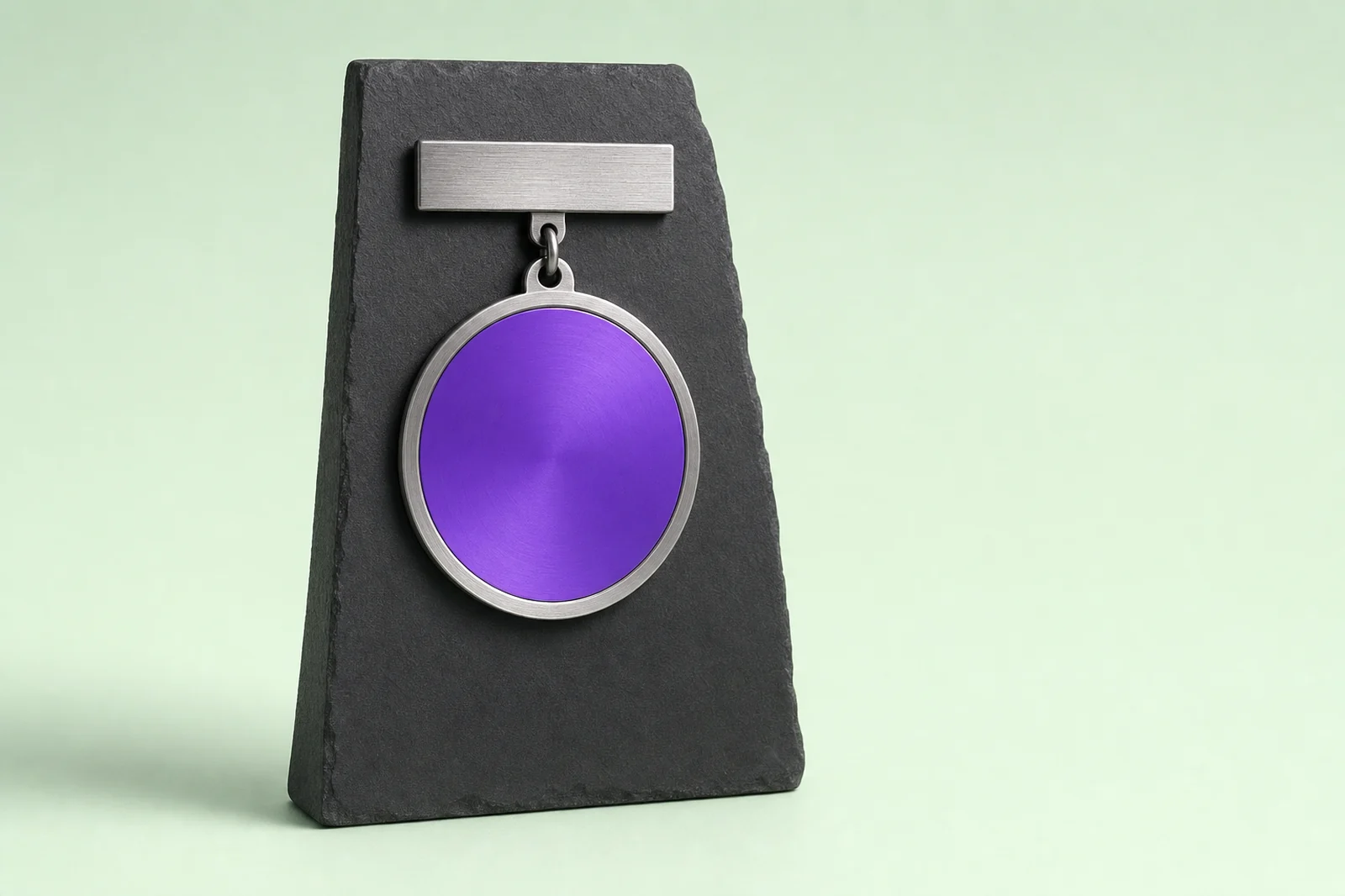 A brass ring stand holding one certified glass disc lit from within