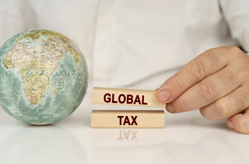 VAT and corporate tax concept image illustrating DMTT 15 Percent UAE: What Businesses Need to Know About the