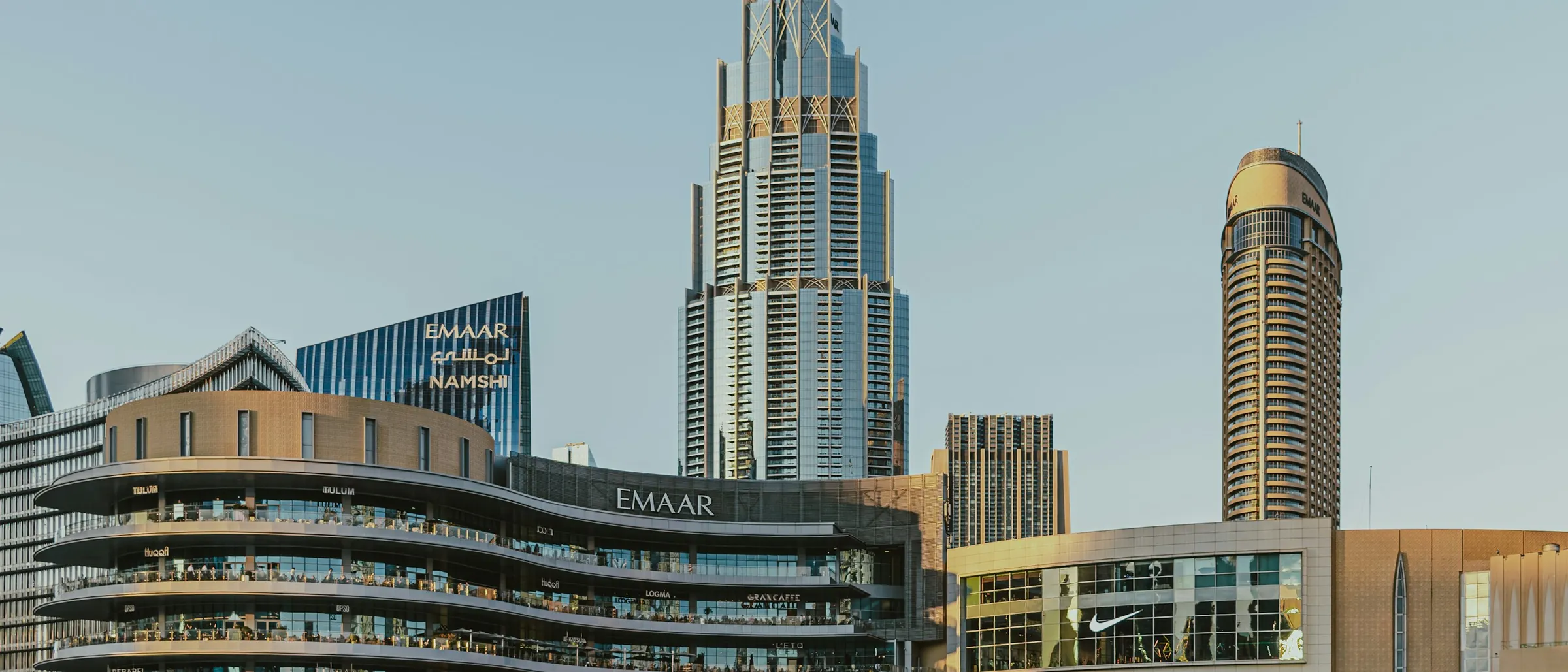 Dubai seen from the water, towers along the shore near the creek